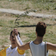 Greek actress Katerina Lehou, playing the role of High Priestess, passes the Olympic flame to the first torch bearer, Greek gymnast Eleftherios Petrounias (Reuters/Yannis Behrakis)